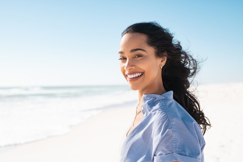 Lady smiles on beach