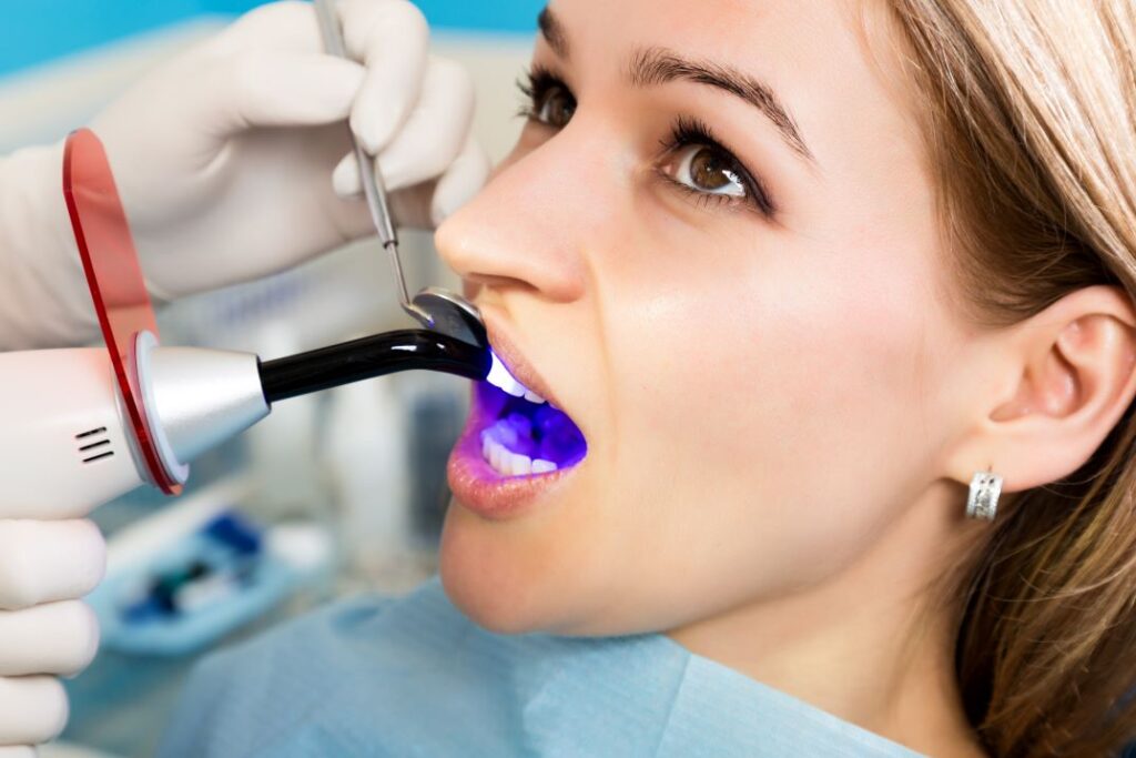 A woman getting a dental bonding restoration.