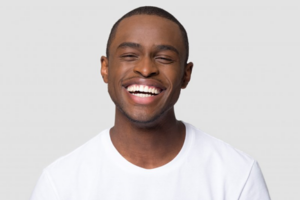 Man smiling with brilliantly whitened teeth